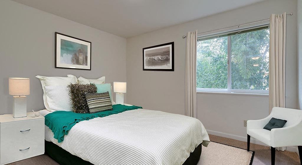 One Bedroom Apartments in Coeur D'Alene ID - Trail Lodge - Bedroom with Plush Carpeting and Large Window