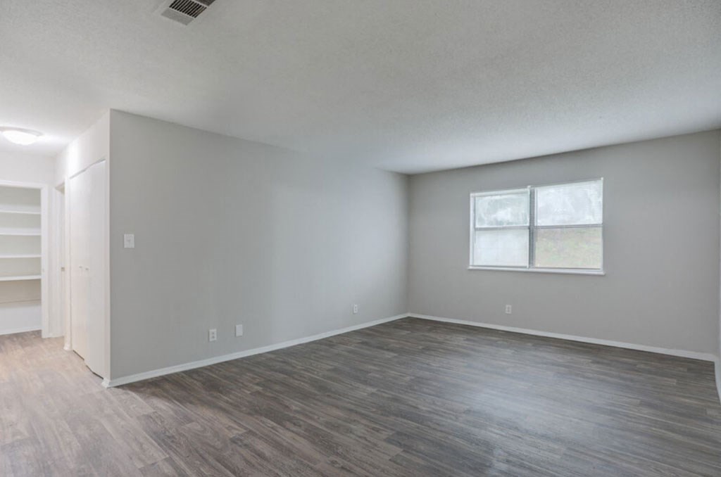Macon, GA Apartment spacious bedroom with hardwood flooring