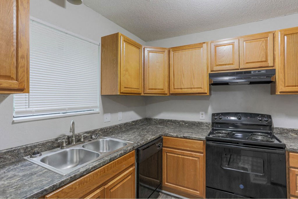 The element 4411, Macon, GA Apartment kitchen with black appliances