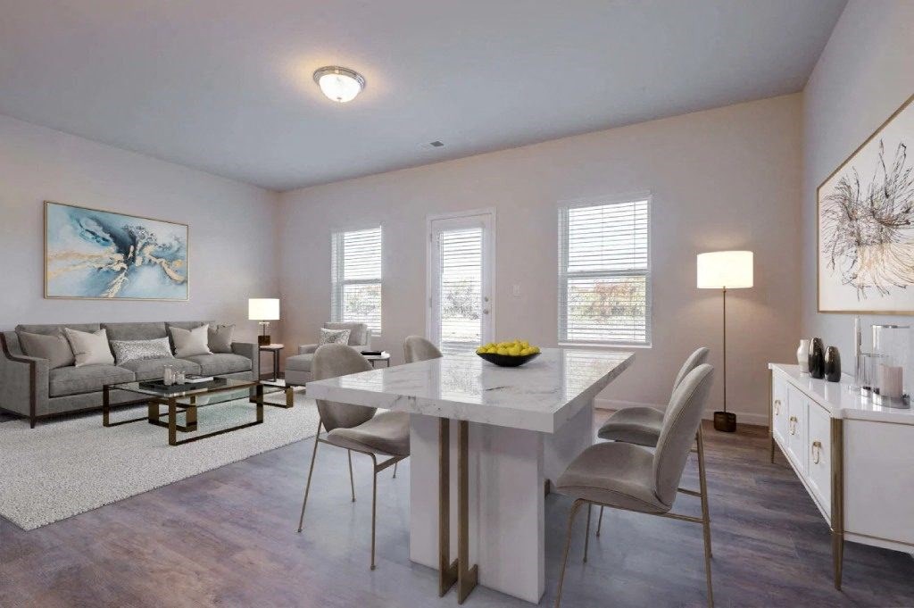 a living room with a dining room table and a couch