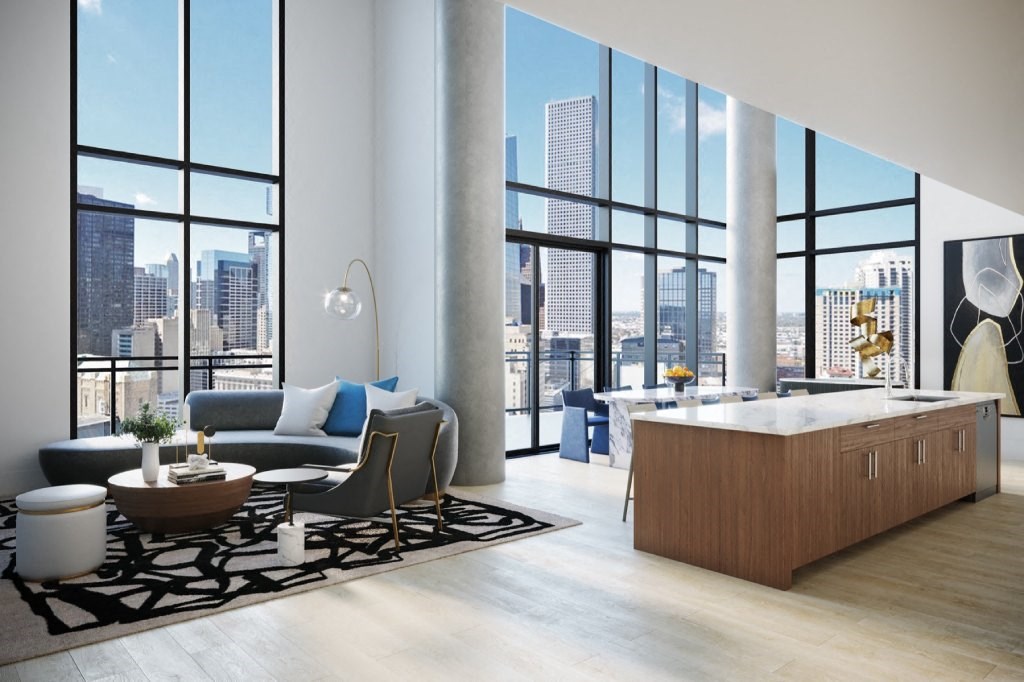a living room and kitchen in an apartment with floor to ceiling windows