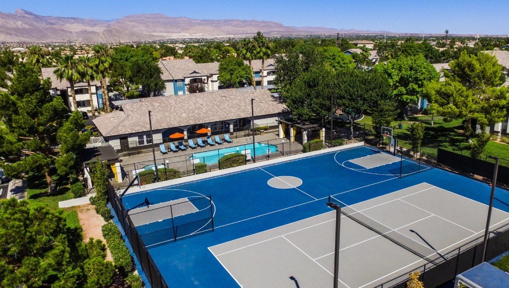 an aerial view of the tennis courts at the resort