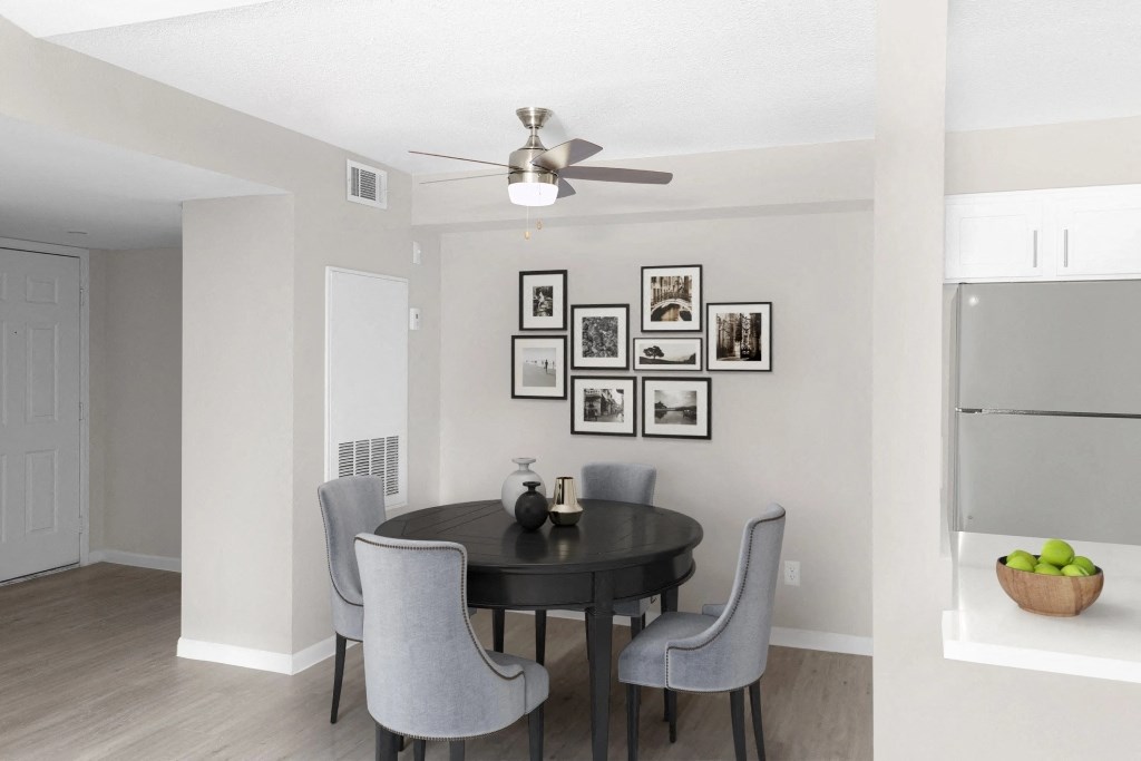 our apartments offer a dining room with a table and chairs