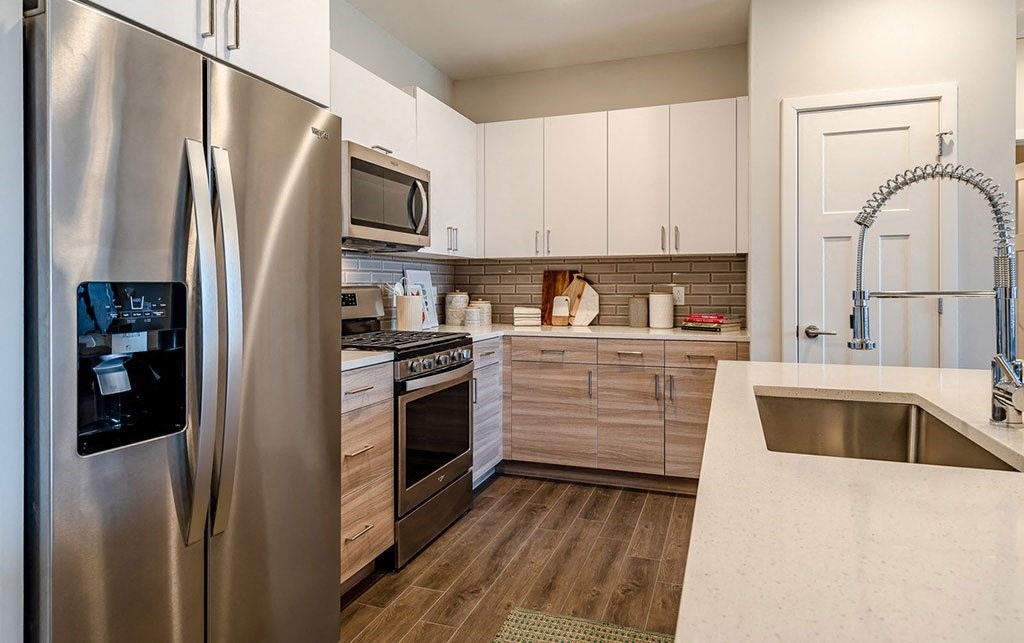 a kitchen with stainless steel appliances and a sink