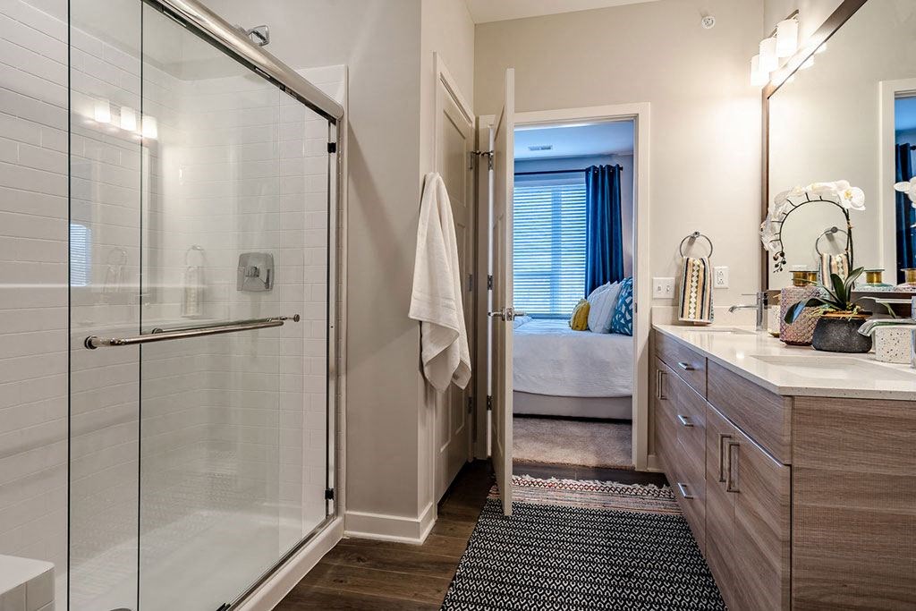 King of Prussia PA Apartments for Rent - SKYE 750 - Bathroom with an Enclosed Glass Shower, Designer Cabinets, and Wood-Style Plank Flooring