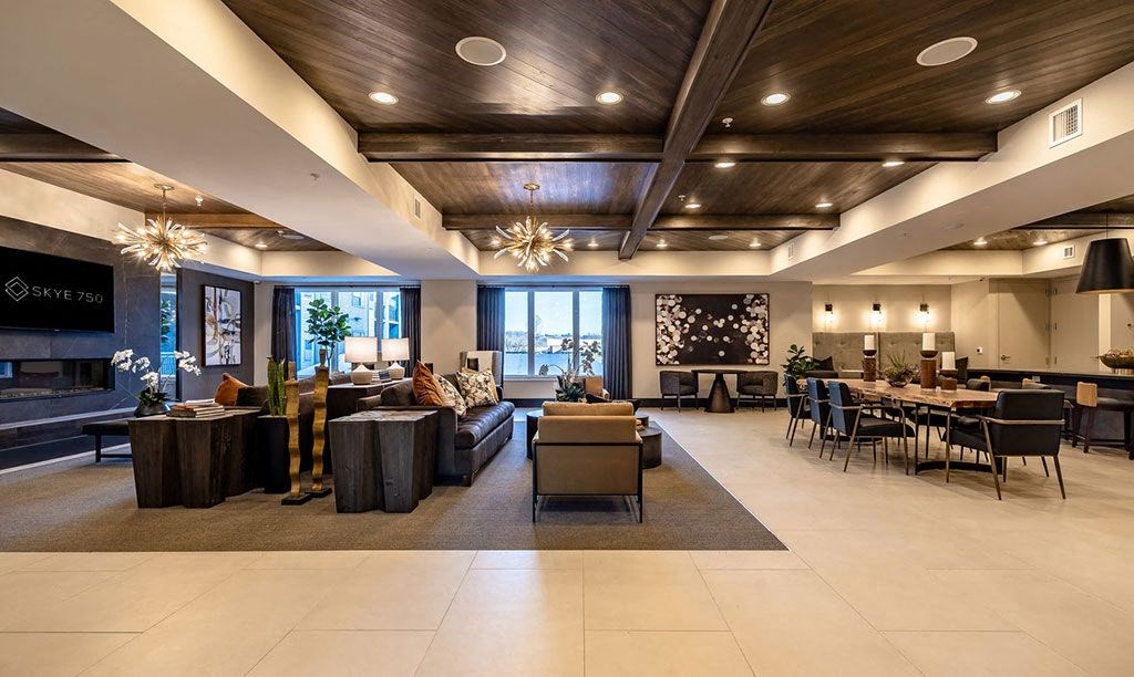 a large lobby with furniture and tables and chairs