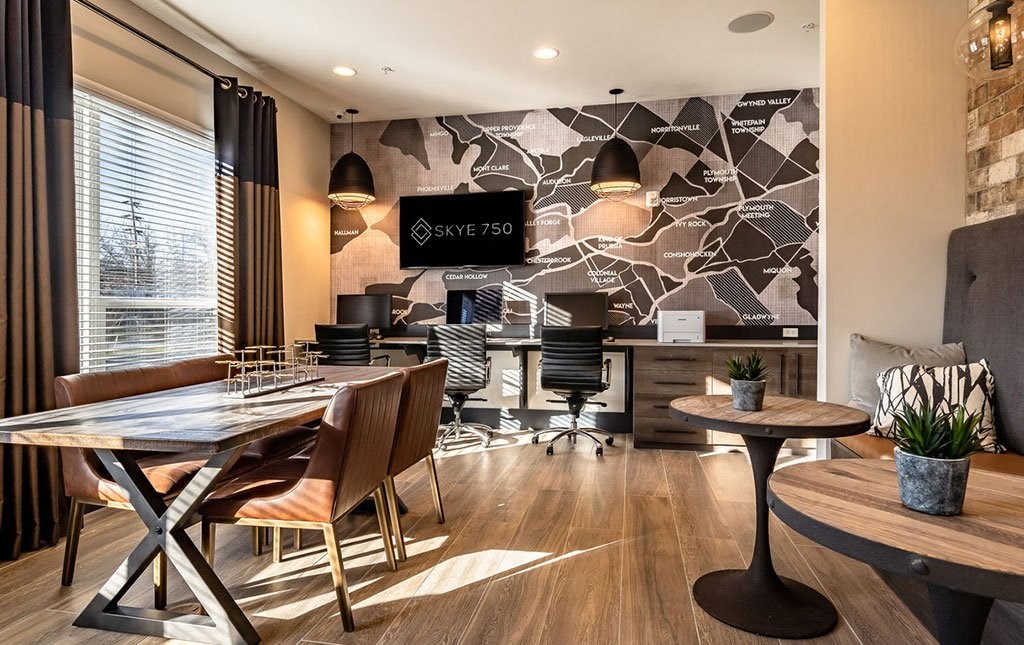 a conference room with a table and chairs