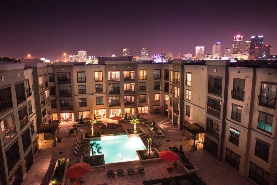 Exterior photo of the The Metropolitan with the pool and apartments