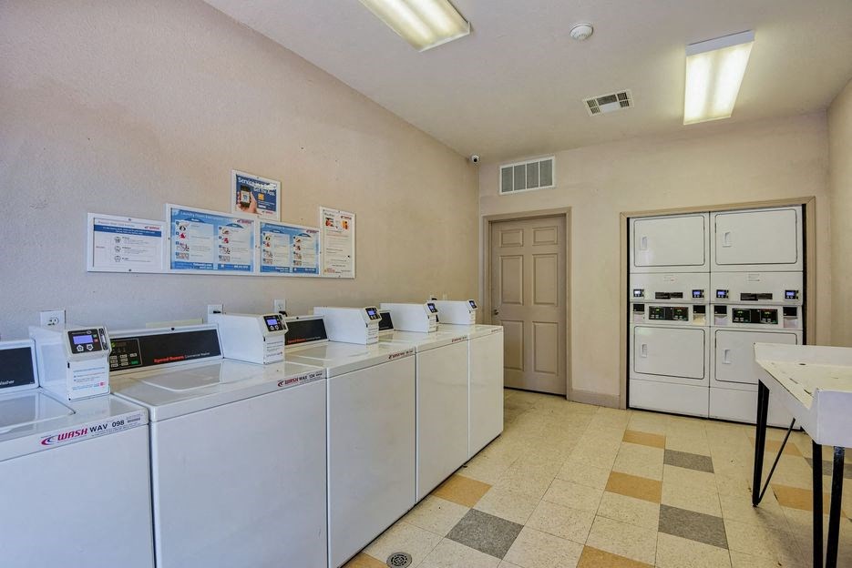 Beaumont, TX Apartments – Breakwater Bay - Laundry Facility with area for folding clothes