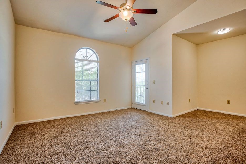 bedroom with carpet floor and window and ceiling fan/light