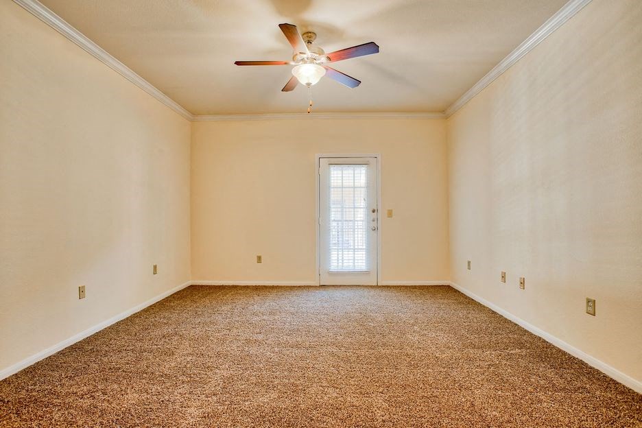 bedroom with carpet floor and window and ceiling fan/light
