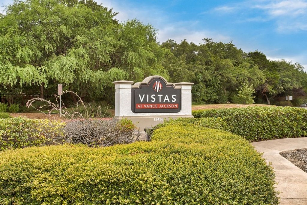 Outside sign with Vistas at Vance Jackson logo