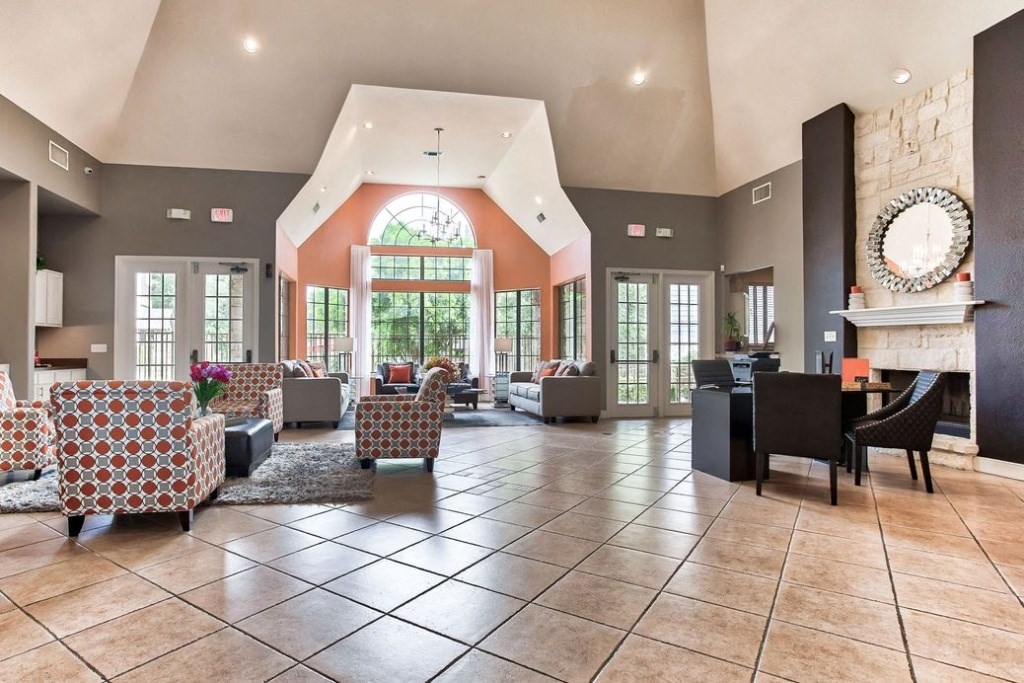 Club house with couches and chairs large windows