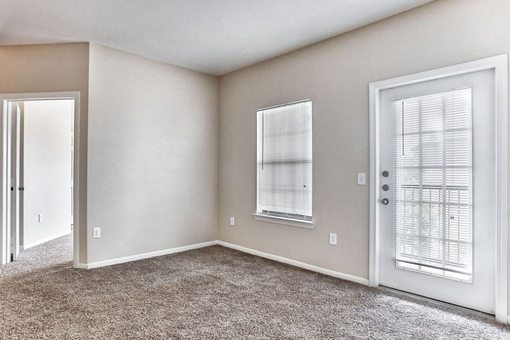 Living room with window doors and carpet floors