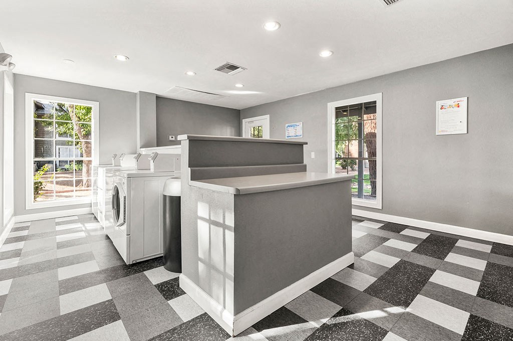 a lobby with a counter and a laundry room