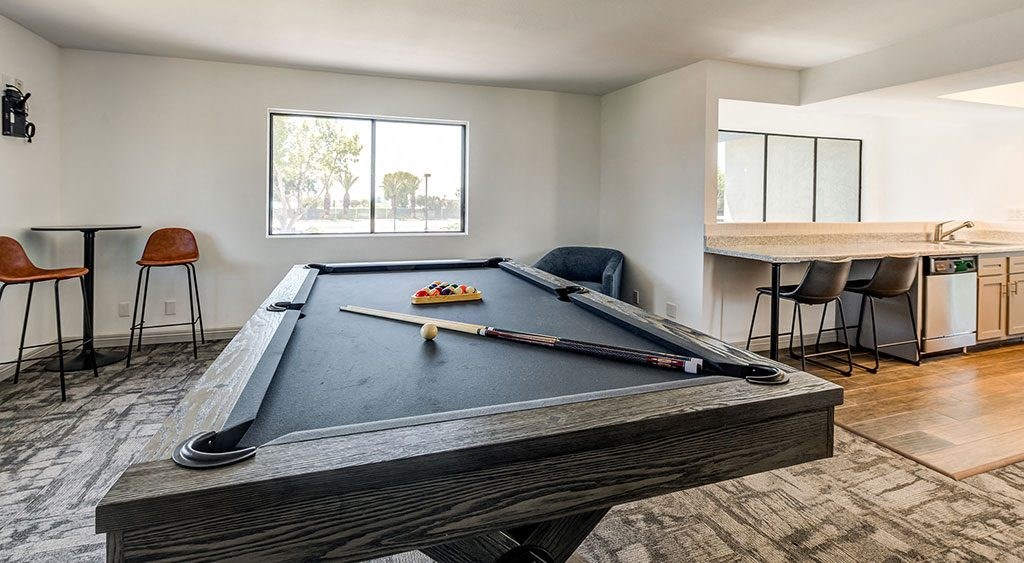 1 BR Apartments in Ontario, CA - Clubhouse Game Room with a Pool Table and Lounge Seating