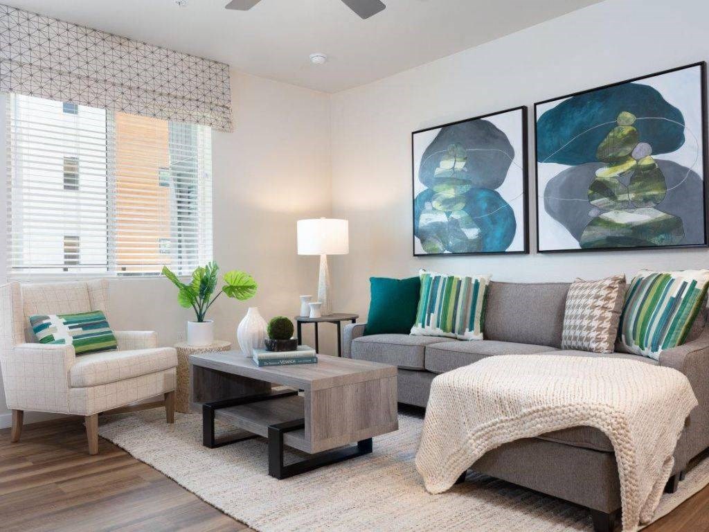 2-Bedroom Apartments in Santa Clara, CA- Santana Terrace - Furnished Living Room with Wood-Style Flooring, a Ceiling Fan, and a Window with Blinds