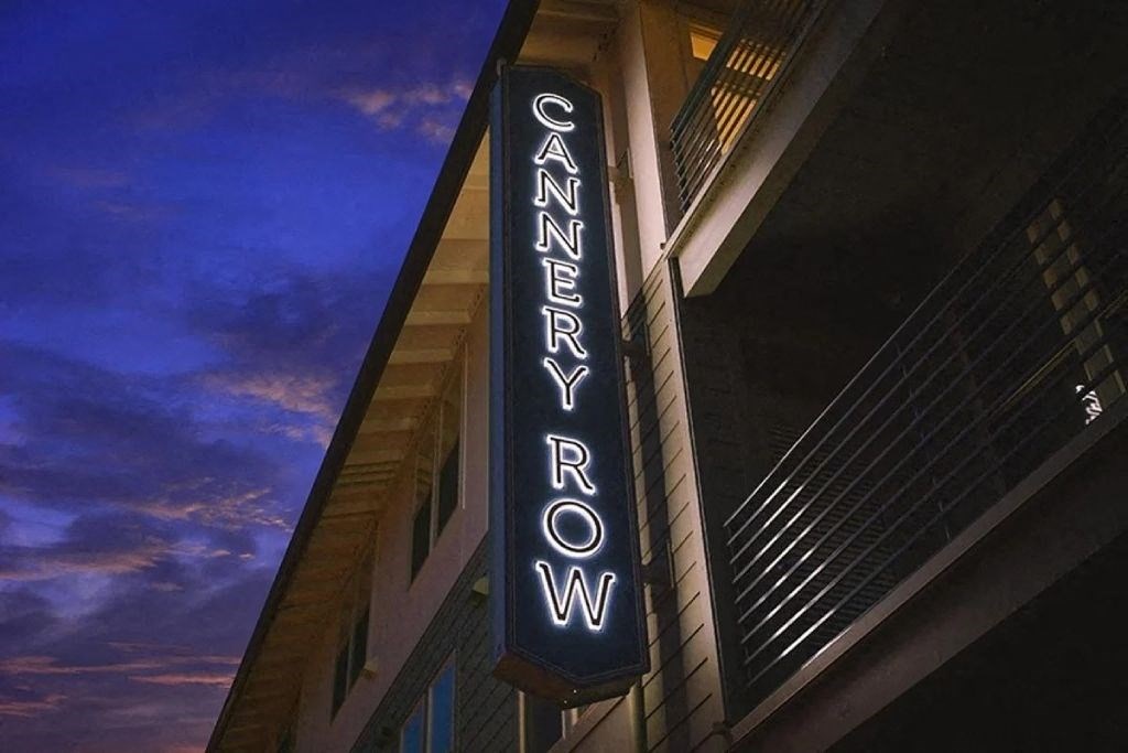 a neon sign is on the side of a building