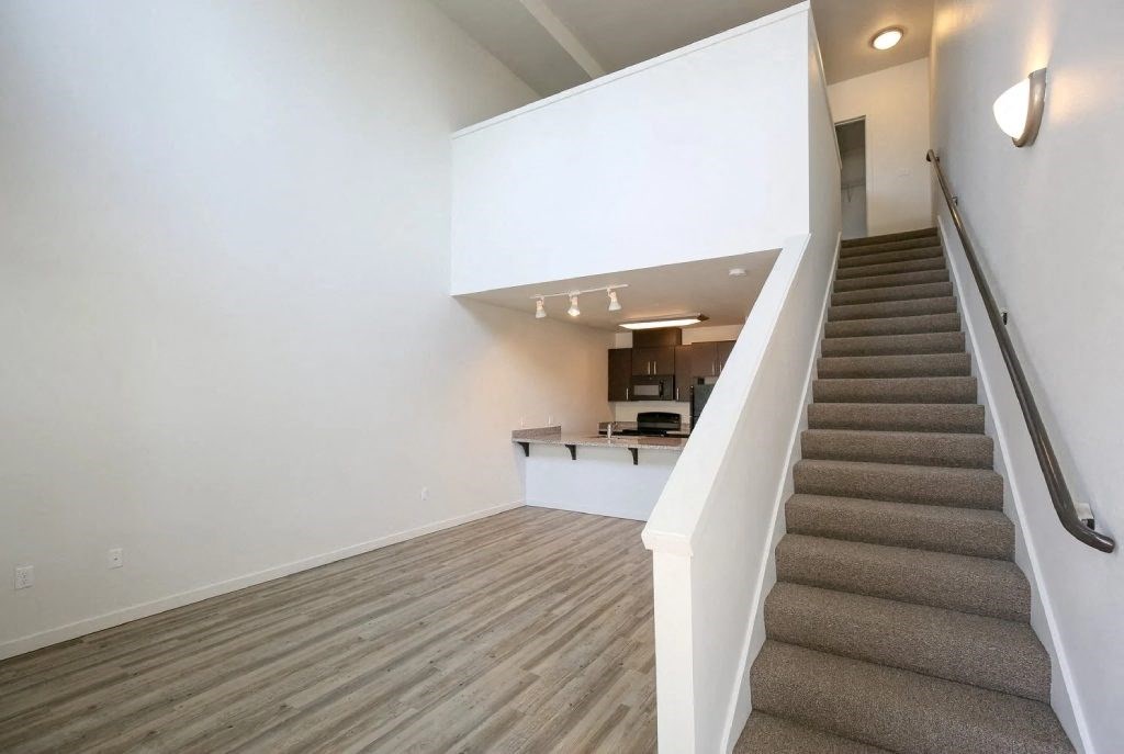 a view of a staircase in a home with carpeted stairs