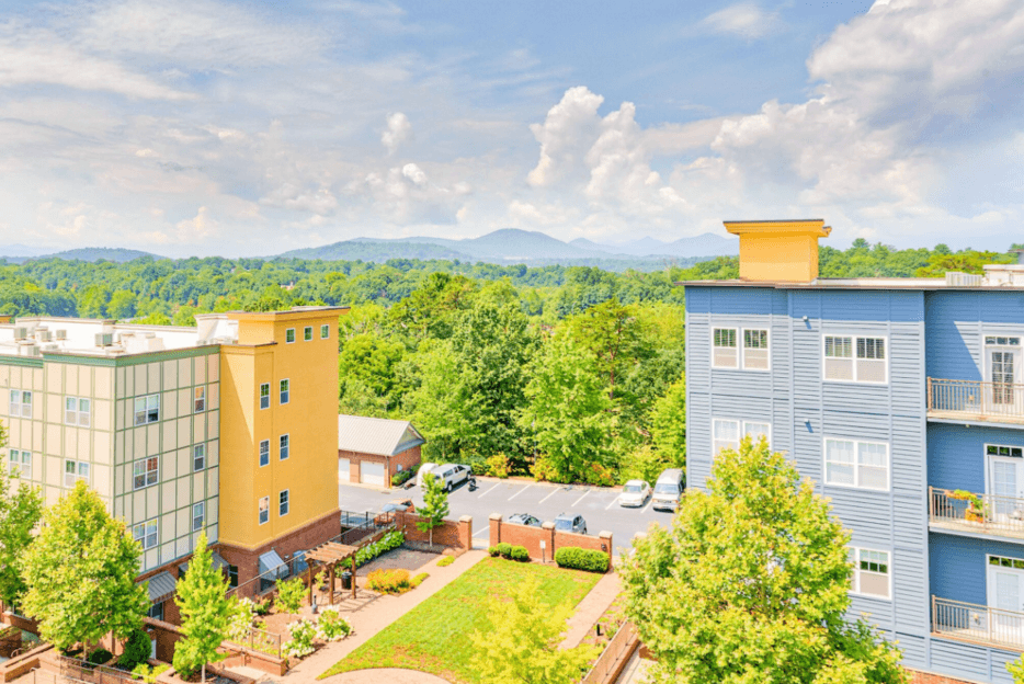 aerial view of the lofts at reynolds village apartment homes and mountain skyline