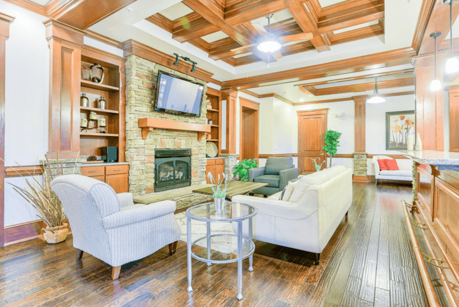 clubhouse lounge area with flat screen tv and couches