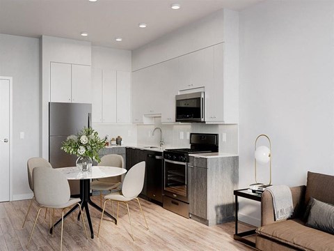 a kitchen and dining room with a table and chairs