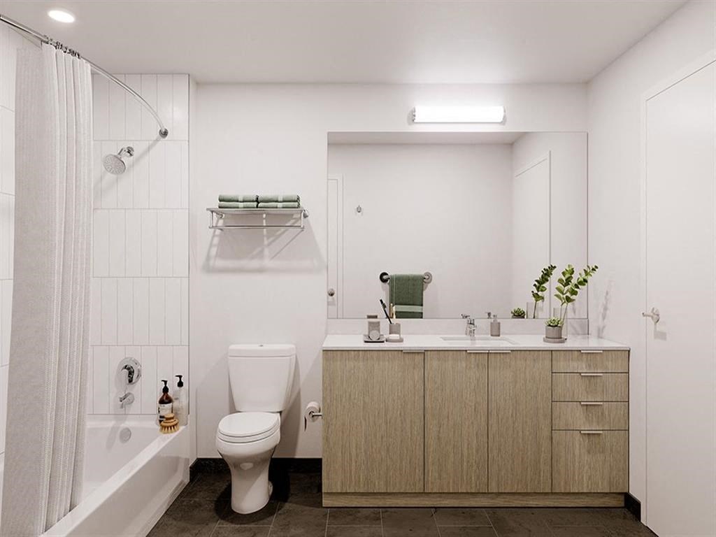 a bathroom with a toilet sink and bathtub