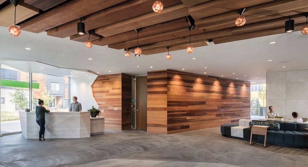 the lobby of a hotel with a reception desk and