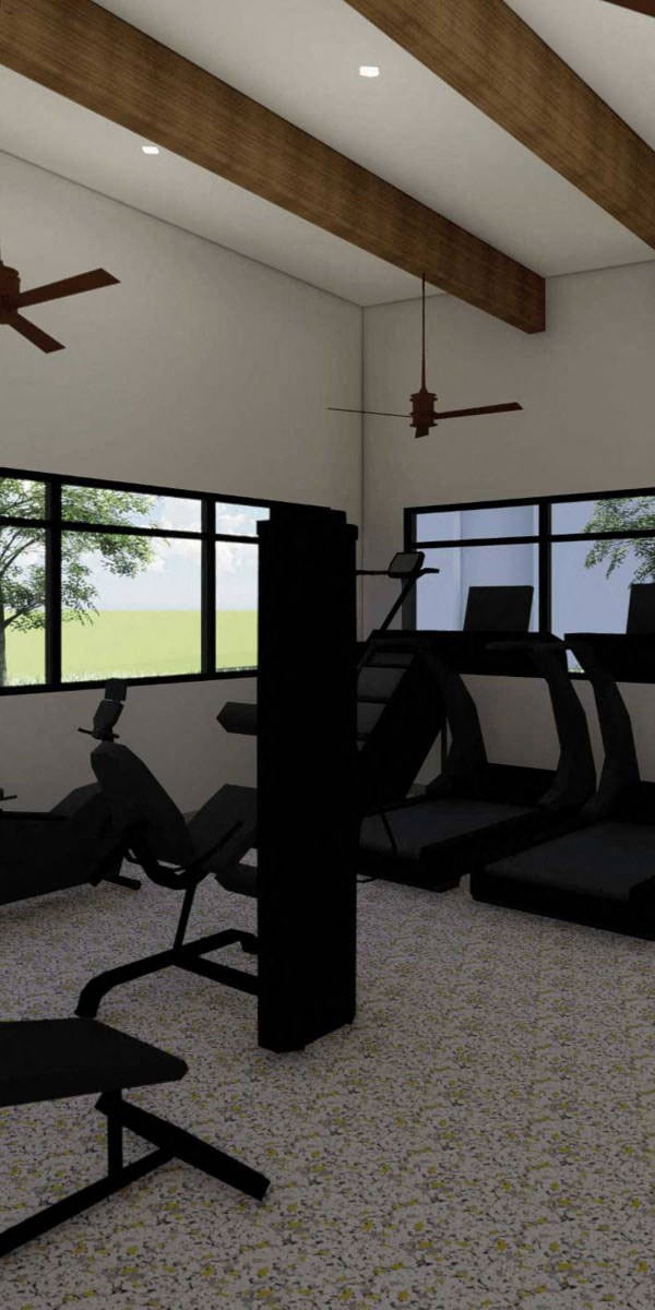 a gym with some exercise machines and chairs