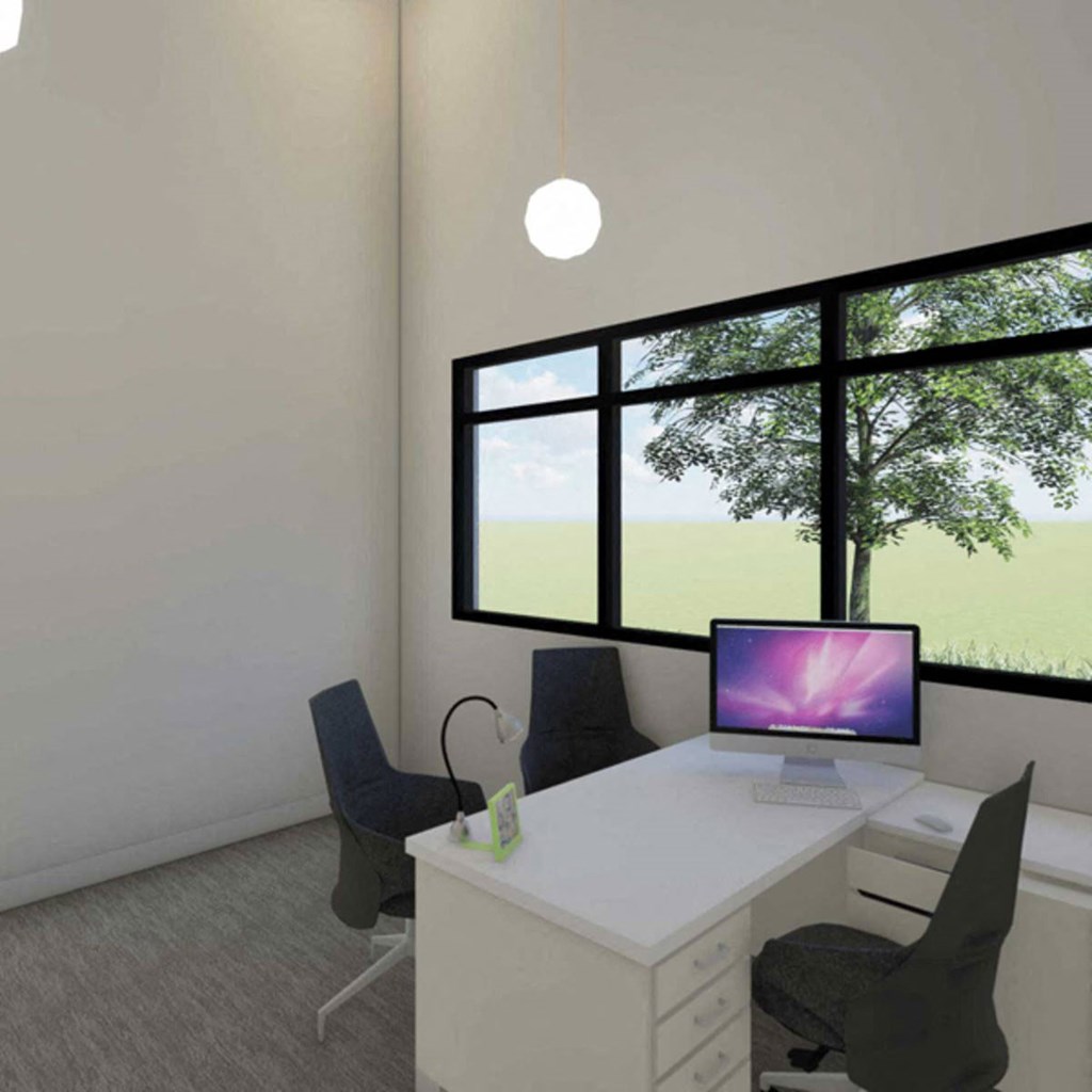 a office with a desk with a computer and a window