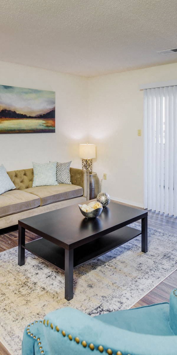 a living room with a couch and a coffee table