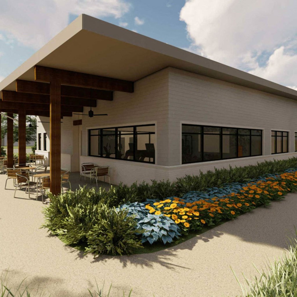 a rendering of the exterior of a building with a garden