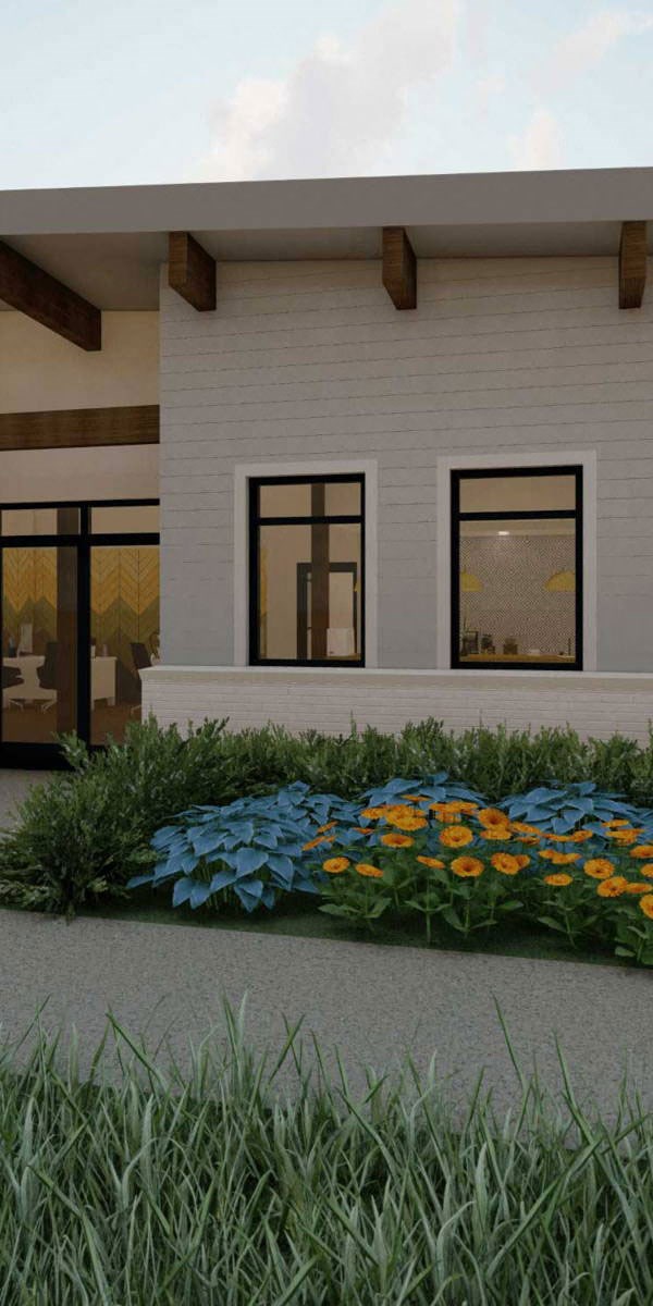 a garden in front of a white house with windows