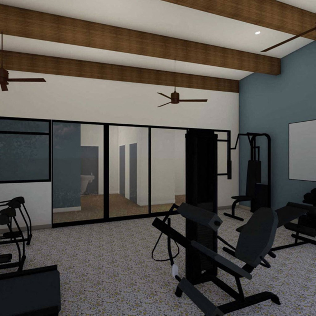 a fitness room with exercise equipment and a large window