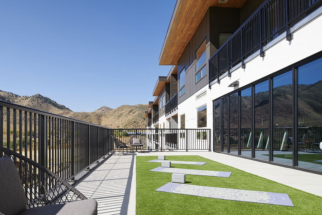 a balcony with a view of the mountains