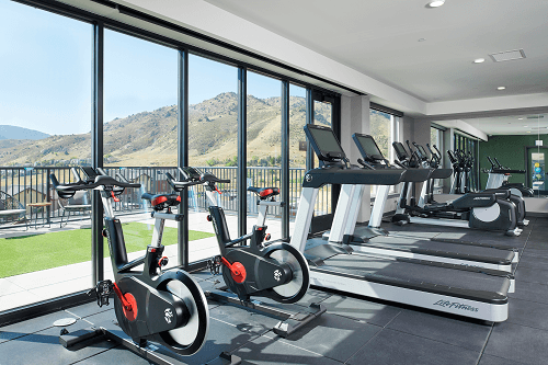 a gym with a view of the mountains in the background