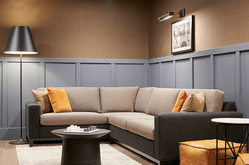 a living room with a couch and tables