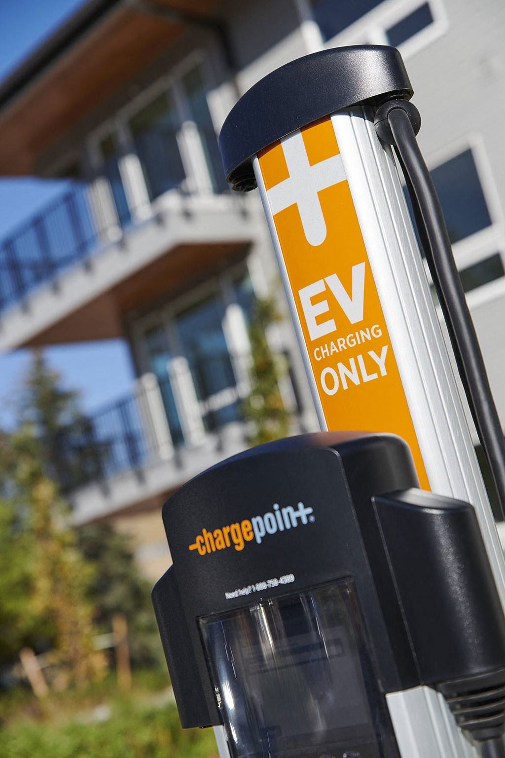 a electric vehicle charging point in front of a house