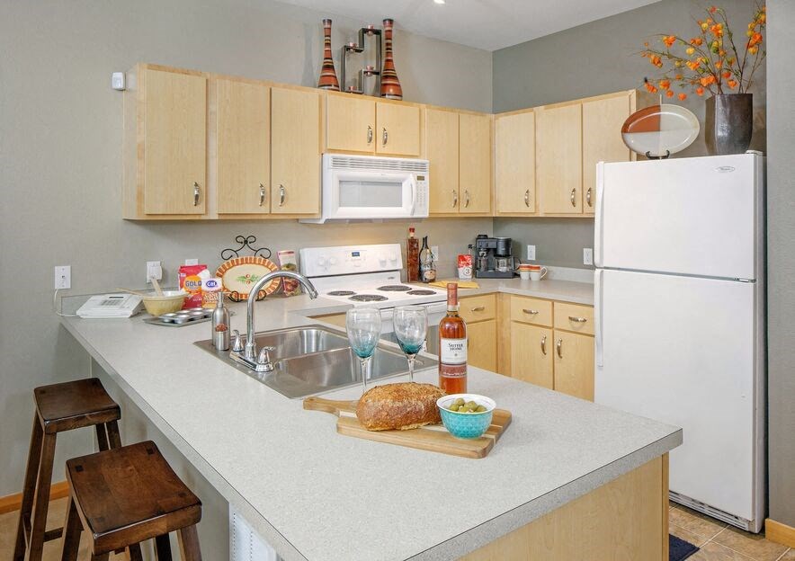 a kitchen with a counter top and a refrigerator