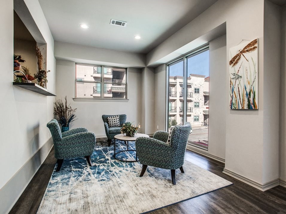 a living room with two chairs and a coffee table