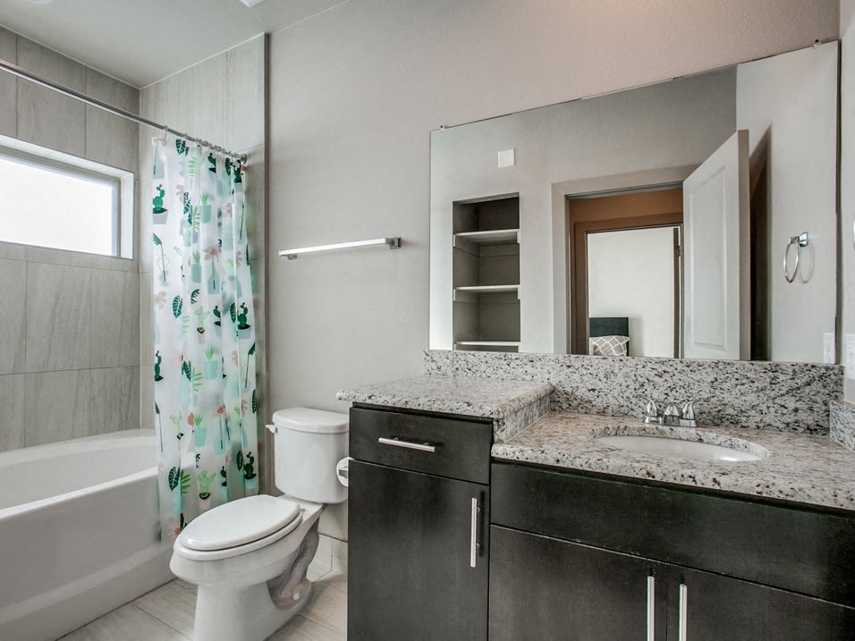 a bathroom with a toilet sink and bathtub