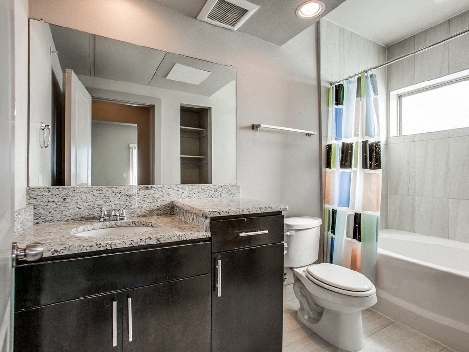 a bathroom with a toilet sink and bathtub