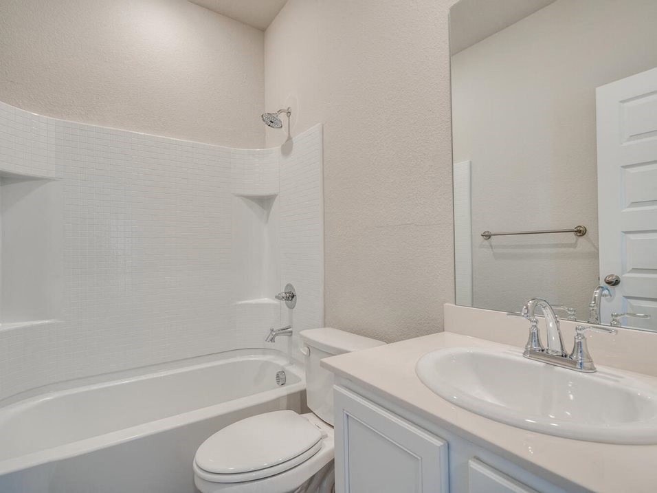 a bathroom with a sink toilet and bathtub
