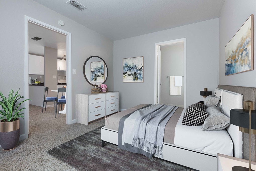 a bedroom with a bed and a dresser in a room