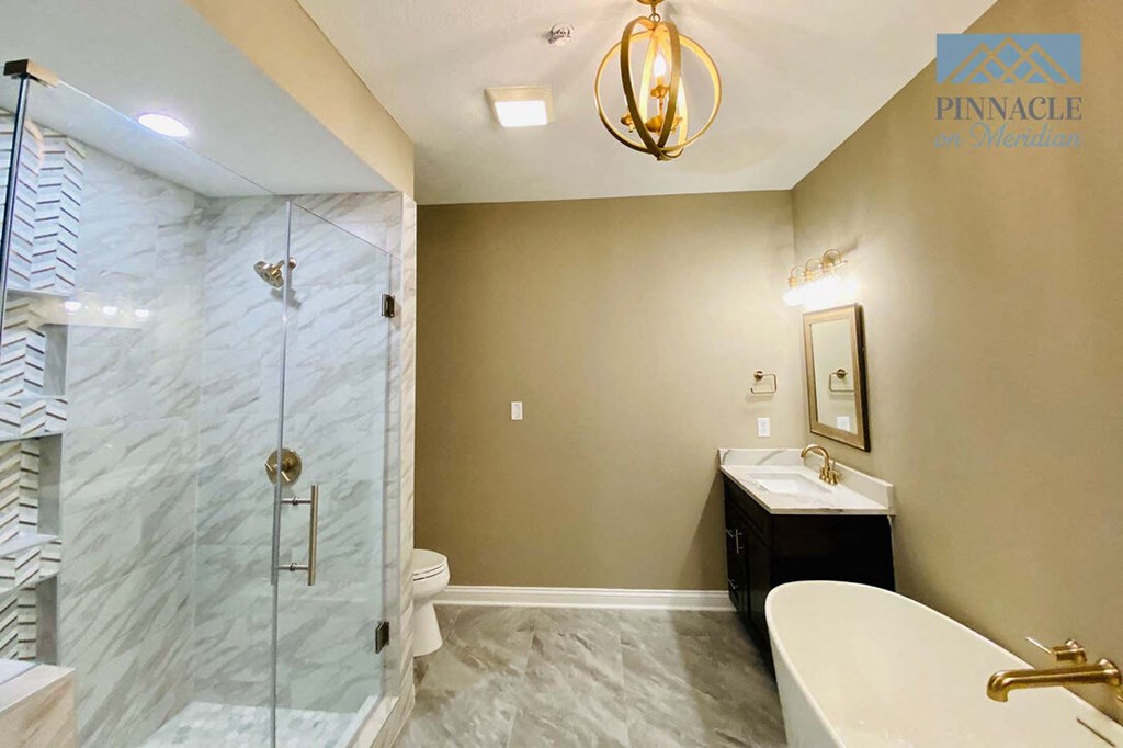 a bathroom with a tub and a sink