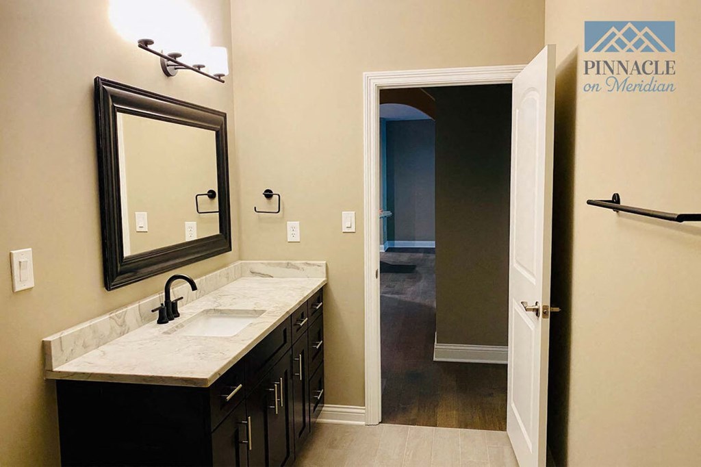 a bathroom with a sink and a mirror