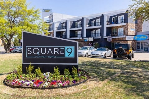 a building with a square 9 sign in front of it