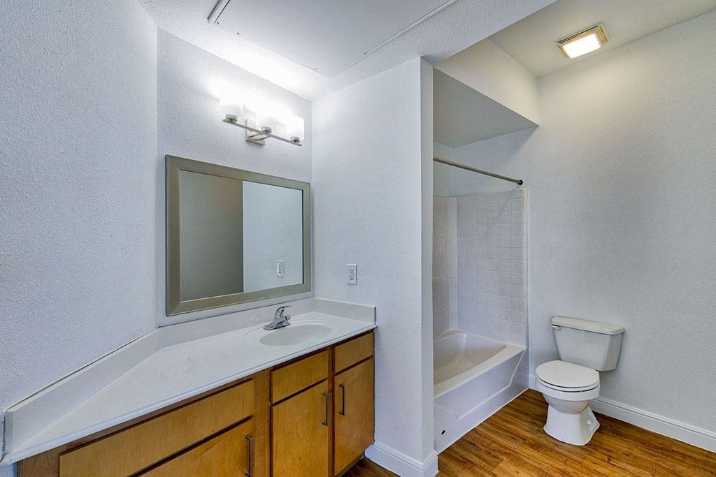 a bathroom with a toilet sink and bathtub