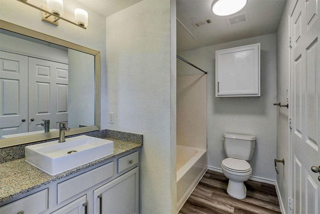 a bathroom with a sink toilet and bathtub