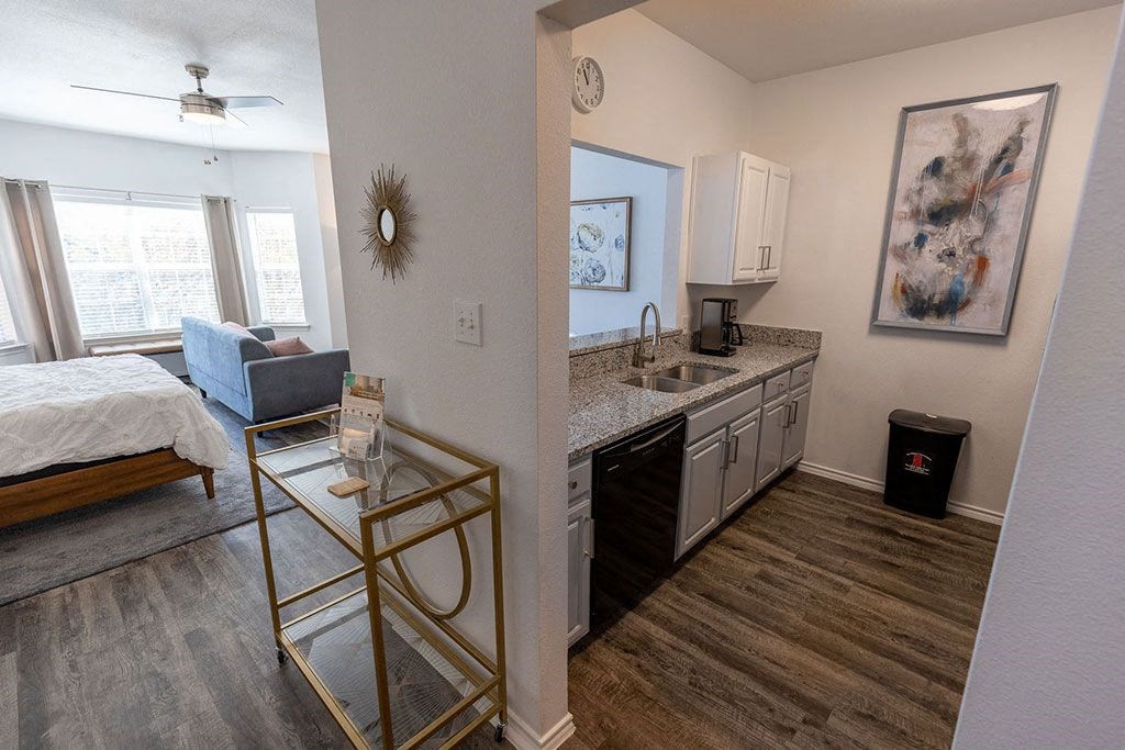 a view of the kitchen and living room in a two bedroom apartment